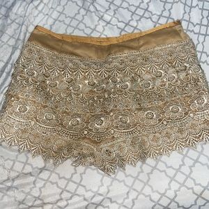 golden flower printed short skirt.